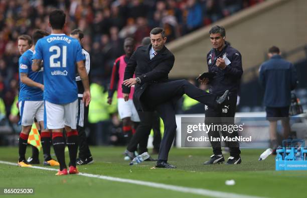 Rangers manager Pedro Caixinha kicks out at a water bottle during the Betfred League Cup Semi Final between Rangers and Motherwell at Hampden Park on...