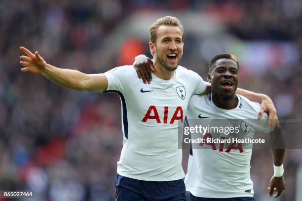Harry Kane of Tottenham Hotspur celebrates scoring his sides first goal with Serge Aurier of Tottenham Hotspur during the Premier League match...