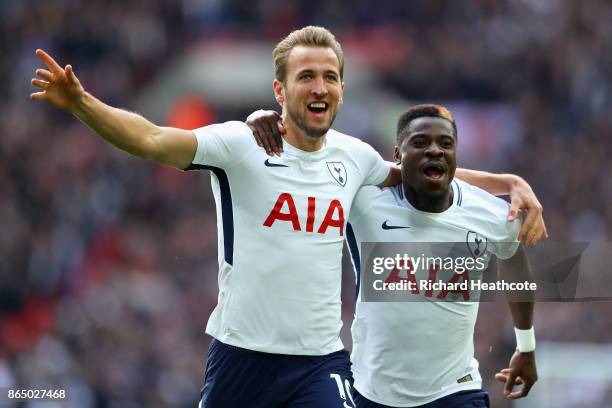 Harry Kane of Tottenham Hotspur celebrates scoring his sides first goal with Serge Aurier of Tottenham Hotspur during the Premier League match...