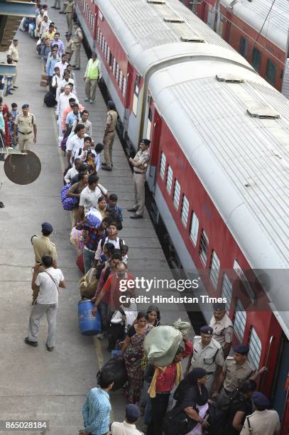 Passengers in long queue to board Shiv Ganga Express train which runs from New Delhi to Varanasi, who want to go to their native place for the Chhath...