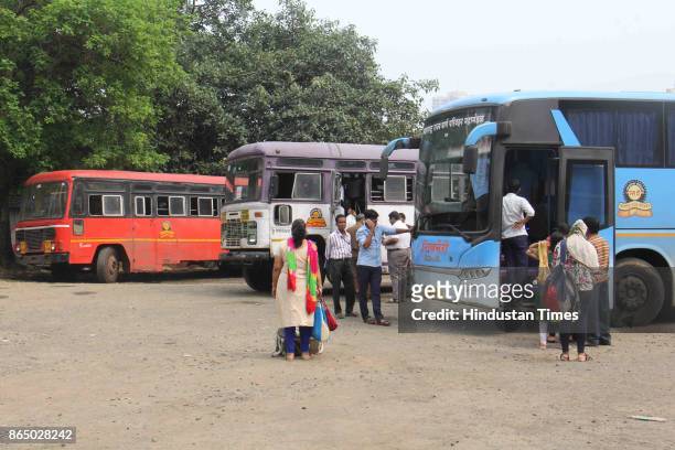Commuters travel in state transport bus as MSRTC bus drivers and conductors call off strike after 4 days and go on duty at Nancy Colony bus depot,...