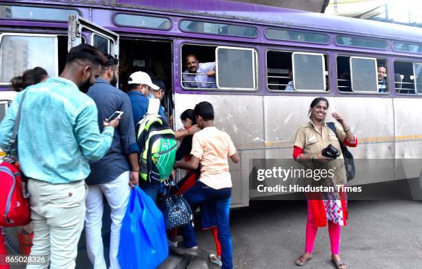 Passengers board state transport bus after strike was called off at Mumbai Central Bus Depo, on October 21, 2017 in Mumbai, India. The Maharashtra...