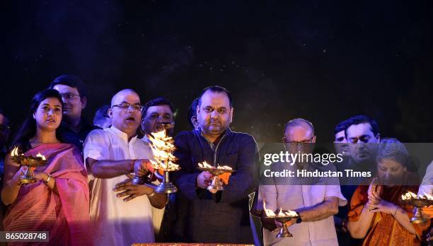 Delhi Lt. Governor Delhi LG Anil Baijal and BJP leader Mahesh Giri, AAP leader Alka Lamba seen during the Yamuna Aarti at Kudsia Ghat, on October 21,...