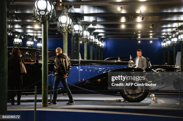 People look at the masterpiece Bugatti Type 41 better known as the Royale at the Cite de l'Automobile museum on October 22 in Mulhouse, northwestern...