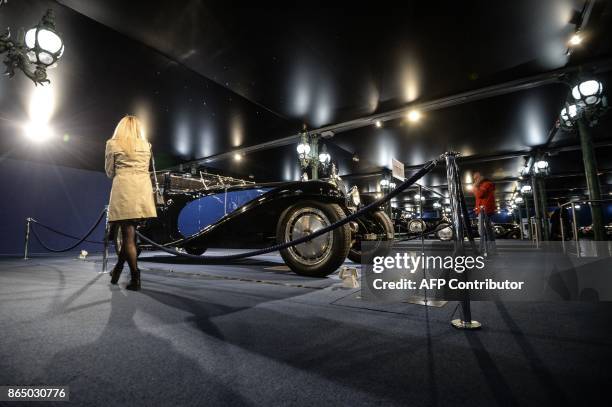 People look at the masterpiece Bugatti Type 41 better known as the Royale at the Cite de l'Automobile museum on October 22 in Mulhouse, northwestern...