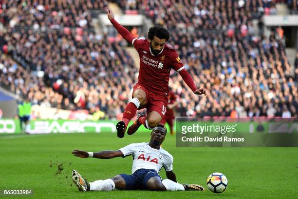 Serge Aurier of Tottenham Hotspur fouls Mohamed Salah of Liverpool during the Premier League match between Tottenham Hotspur and Liverpool at Wembley...