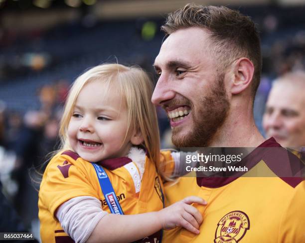Louis Moult of Motherwell celebrates the end with his daughter Isla after the Betfred Cup Semi Final at Hampden Park on October 22, 2017 in Glasgow,...