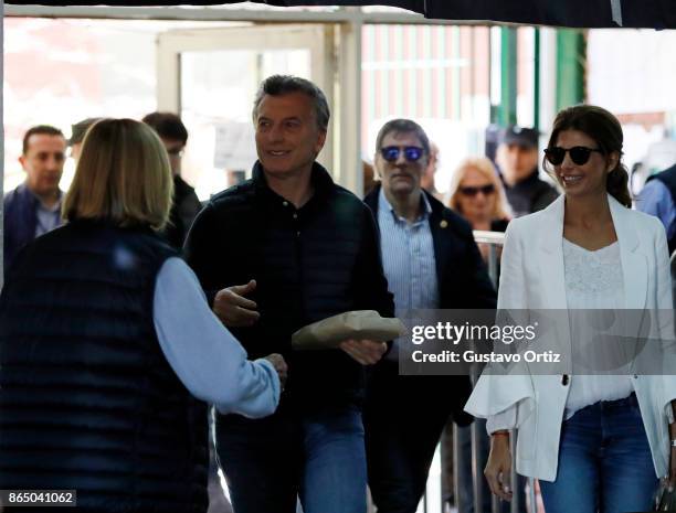 President of Argentina Mauricio Macri and his wife Juliana Awada look on during the Parliament elections at Wenceslao Posse school on October 22,...