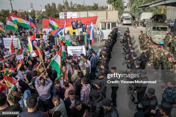 Hundreds of people protest outisde the Russian consulate on October 22, 2017 in Erbil, Iraq. Kurds claim they are under attack by Shiite Hashd...