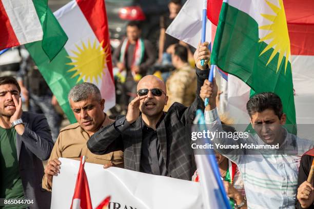 Hundreds of people protest outisde the Russian consulate on October 22, 2017 in Erbil, Iraq. Kurds claim they are under attack by Shiite Hashd...