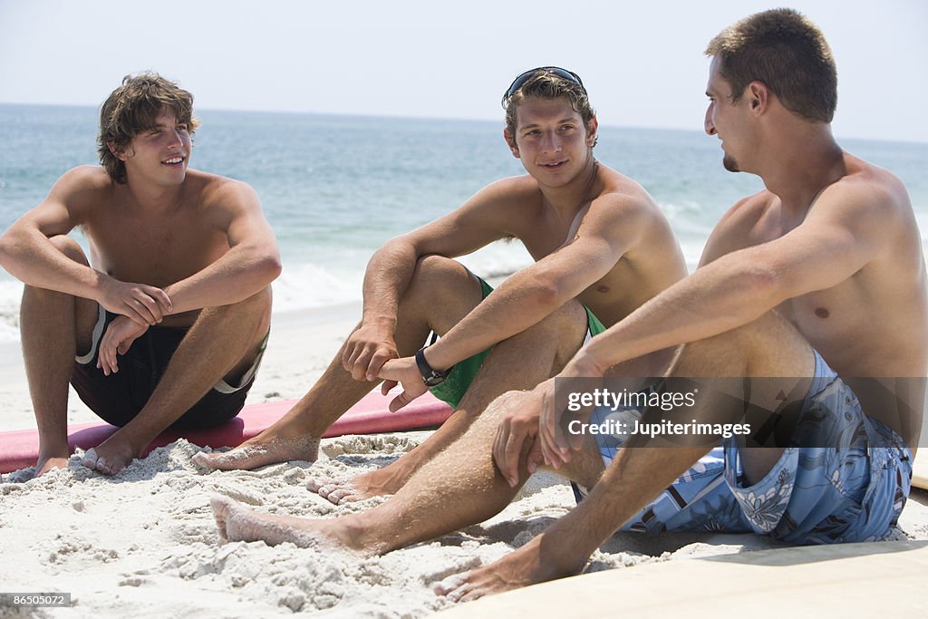 Men sitting on beach
