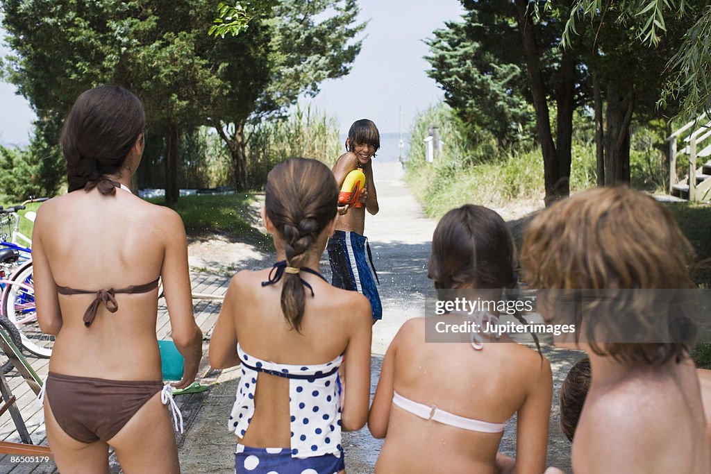 Children having water fight