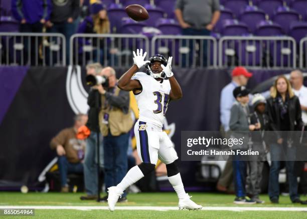 Bobby Rainey of the Baltimore Ravens catches a pass while warming up on field before the game against the Minnesota Vikings on October 22, 2017 at...