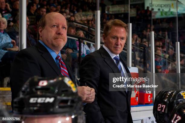 Portland Winterhawks' assistant coach Danny Flynn and head coach Mike Johnston stand on the bench at the Kelowna Rockets at Prospera Place on October...