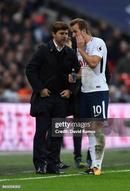 Mauricio Pochettino, Manager of Tottenham Hotspur speaks to Harry Kane of Tottenham Hotspur during the Premier League match between Tottenham Hotspur...