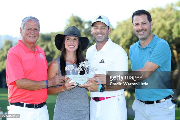 Sergio Garcia of Spain poses with the trophy and wife Angela Akins following his victory during the final round of of the Andalucia Valderrama...