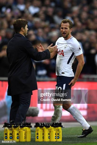 Harry Kane of Tottenham Hotspur and Mauricio Pochettino, Manager of Tottenham Hotspur embrace after he is subbed during the Premier League match...