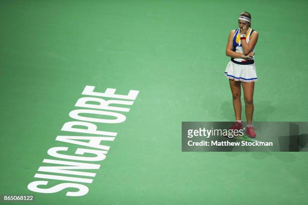 Jelena Ostapenko of Latvia reacts to a lost point while playing Garbine Muguruza of Spain during day 1 of the BNP Paribas WTA Finals Singapore...