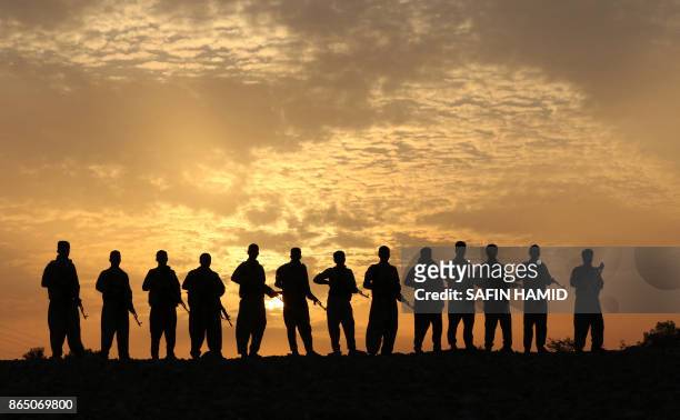 Iranian Kurdish Peshmerga, members of the Iranian Kurdistan Democratic Party , take part in routine military exercise in Koya, 100 kms east of Arbil,...