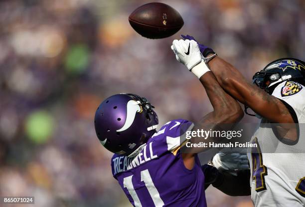 Brandon Carr of the Baltimore Ravens breaks up a pass to Laquon Treadwell of the Minnesota Vikings in the first quarter of the game on October 22,...