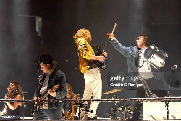 Sarah Neufeld, Win Butler, Richard Reed Parry and William Butler of Arcade Fire perform during the ÔInfinite ContentÕ tour at ORACLE Arena on October...