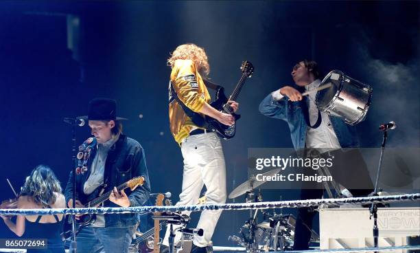 Sarah Neufeld, Win Butler, Richard Reed Parry and William Butler of Arcade Fire perform during the ÔInfinite ContentÕ tour at ORACLE Arena on October...