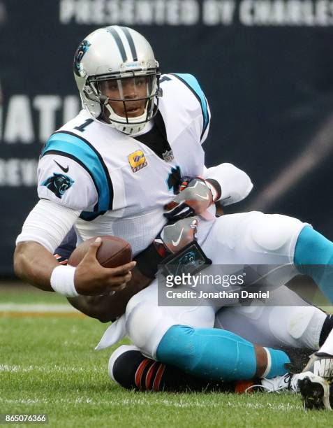 Quarterback Cam Newton of the Carolina Panthers is sacked by Danny Trevathan of the Chicago Bears in the first quarter at Soldier Field on October...