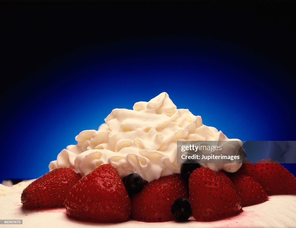 Whipped cream and strawberries