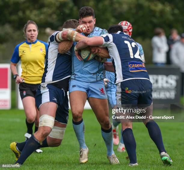 London Scottish's Ben Mosses is tackled by Yorkshire Carnegie's Richard Beck and Tom Casson during the British and Irish Cup Pool 3 match between...