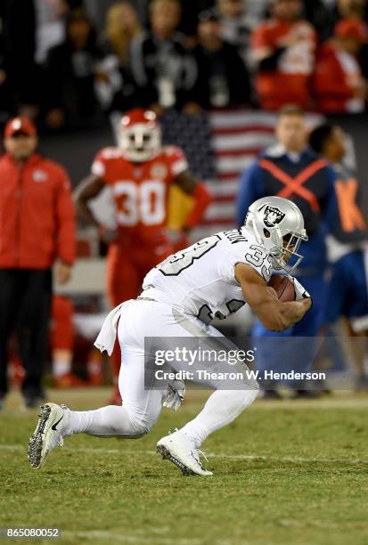 DeAndre Washington of the Oakland Raiders carries the ball against the Kansas City Chiefs during their NFL football game at Oakland-Alameda County...