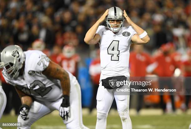 Derek Carr of the Oakland Raiders calls out offensive signals against the Kansas City Chiefs during their NFL football game at Oakland-Alameda County...