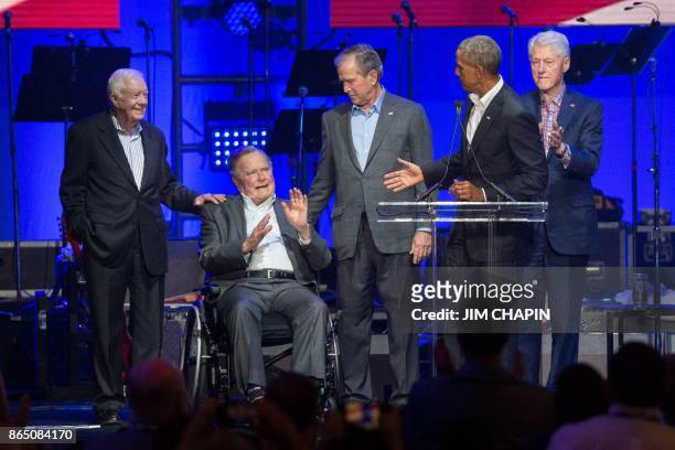 Former US Presidents, Jimmy Carter, George H. W. Bush, Barack Obama, George W. Bush and Bill Clinton attend the Hurricane Relief concert in College...