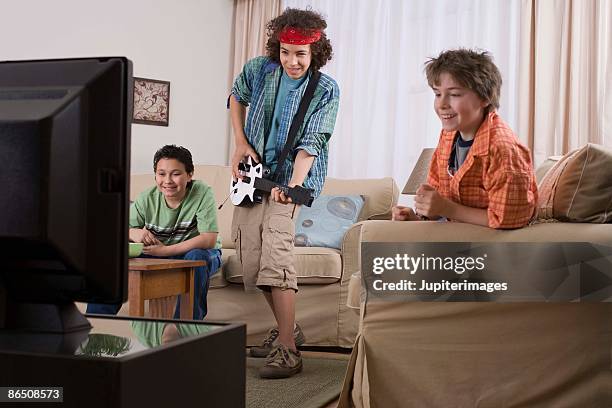 friends playing video games - game three stockfoto's en -beelden