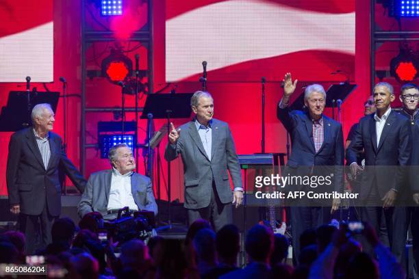 Former US Presidents, Jimmy Carter, George H. W. Bush, George W. Bush, Bill Clinton and Barack Obama attend the Hurricane Relief concert in College...