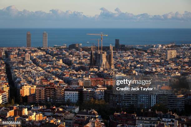 The sun sets over the Sagrada Familia on October 22, 2017 in Barcelona, Spain. The Spanish government is to take steps to suspend Catalonia's...