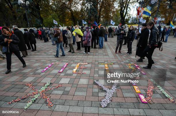 Protesters laid with the candies the frase &quot;Petya - eat it&quot; during a protest in Kyiv, Ukraine, Oct.22, 2017. Dozens Ukrainians set up a...