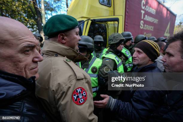 Protesters confront with the police which block the vehicle with sound-amplifying facilities in Kyiv, Ukraine, Oct.22, 2017. Dozens Ukrainians set up...