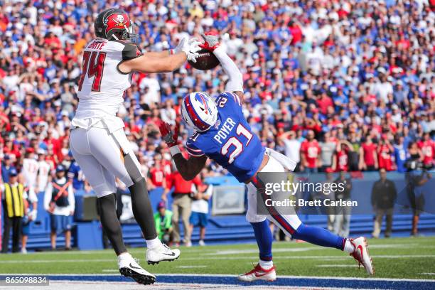 Jordan Poyer of the Buffalo Bills blocks the ball as Cameron Brate of the Tampa Bay Buccaneers attempts to catch it during the first quarter of an...