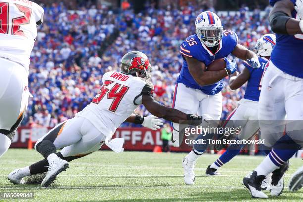 Lavonte David of the Tampa Bay Buccaneers attempts to tackle Mike Tolbert of the Buffalo Bills during the second quarter of an NFL game on October...