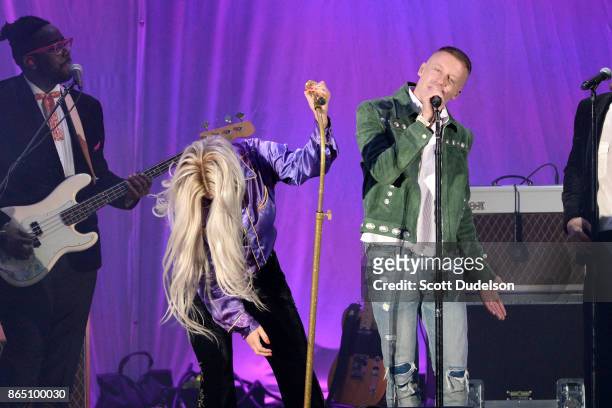 Singers Kesha and Macklemore perform onstage during the 5th annual "We Can Survive" benefit concert presented by CBS Radio at the Hollywood Bowl on...