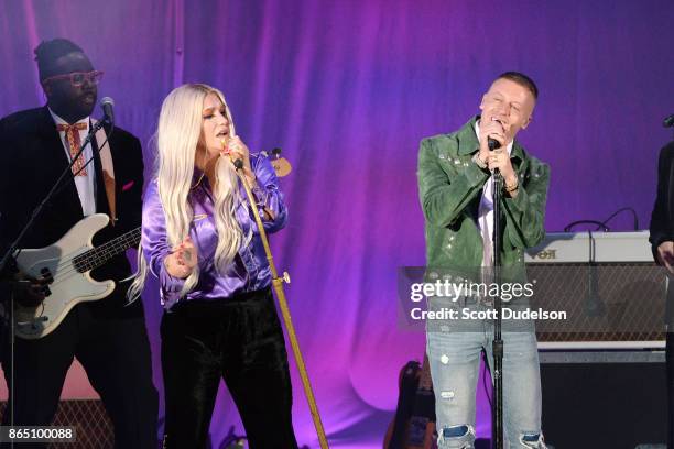 Singers Kesha and Macklemore perform onstage during the 5th annual "We Can Survive" benefit concert presented by CBS Radio at the Hollywood Bowl on...