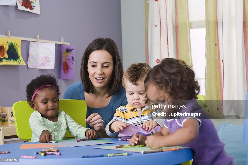 Teacher and toddlers in daycare