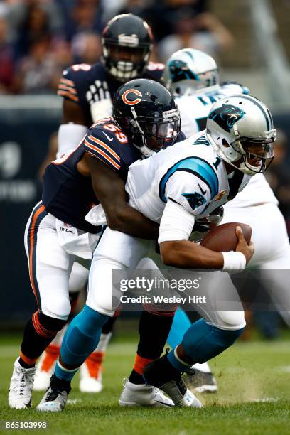 Quarterback Cam Newton of the Carolina Panthers is sacked by Danny Trevathan of the Chicago Bears in the first quarter at Soldier Field on October...