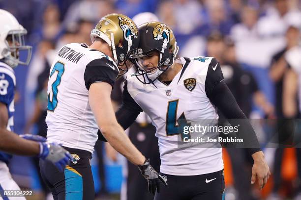 Josh Lambo of the Jacksonville Jaguars celebrates with Brad Nortman after a field goal against the Indianapolis Colts during the first half at Lucas...