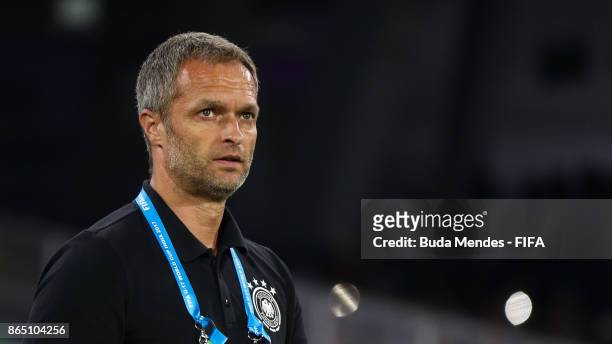 Head coach Christian Wueck of Germany enters to the filed during the FIFA U-17 World Cup India 2017 Quarter Final match between Germany and Brazil at...
