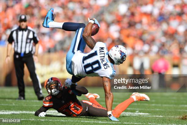 Rishard Matthews of the Tennessee Titans tumbles through the air after being tackled by Briean Boddy-Calhoun of the Cleveland Browns in the second...