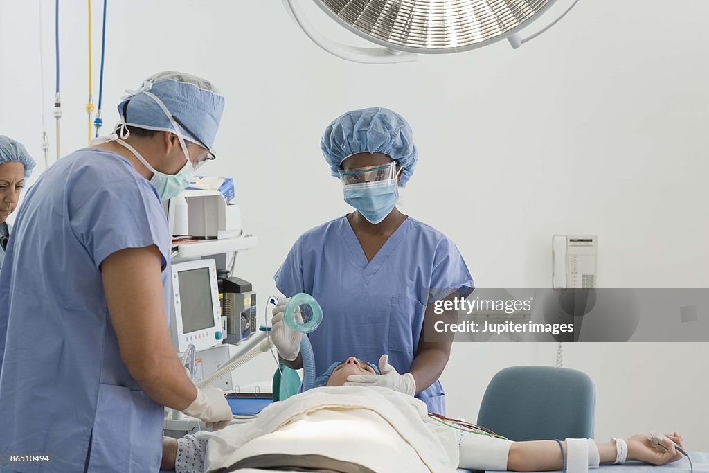 Doctors with patient in hospital