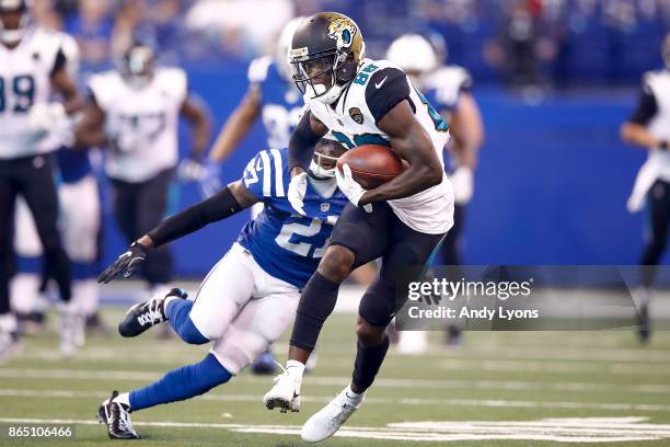 Allen Hurns of the Jacksonville Jaguars runs with the ball after a reception defended by Nate Hairston of the Indianapolis Colts during the first...