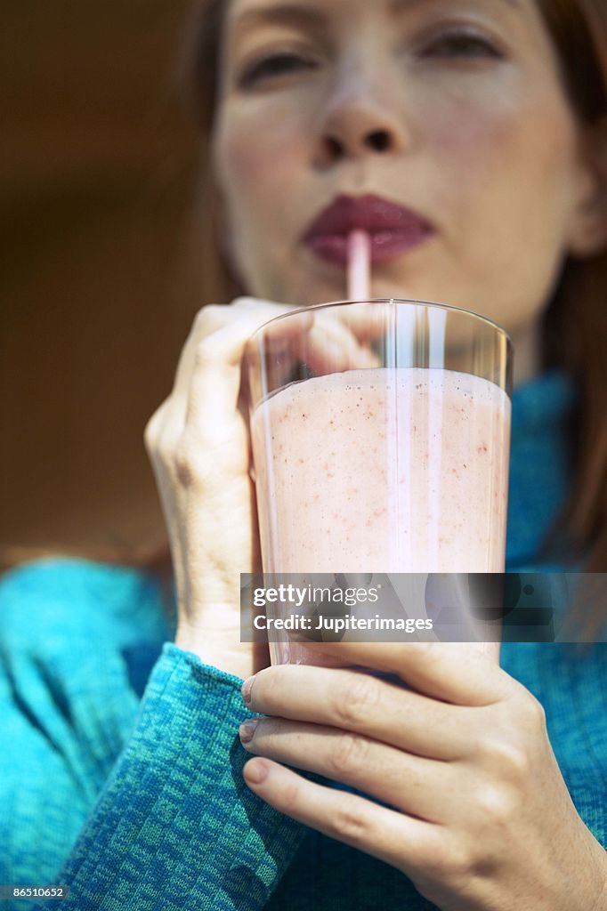 Woman drinking smoothie