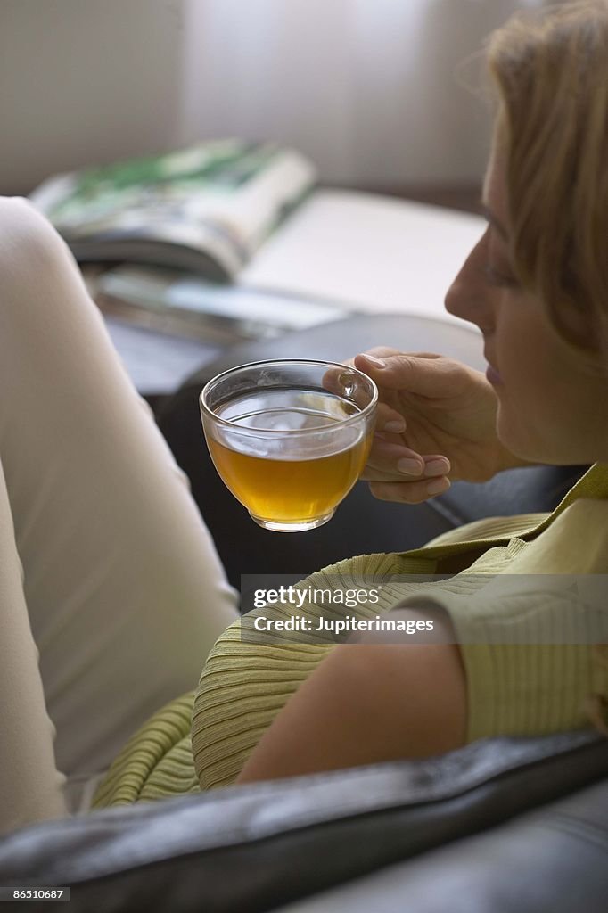 Woman Relaxing with Cup of Tea